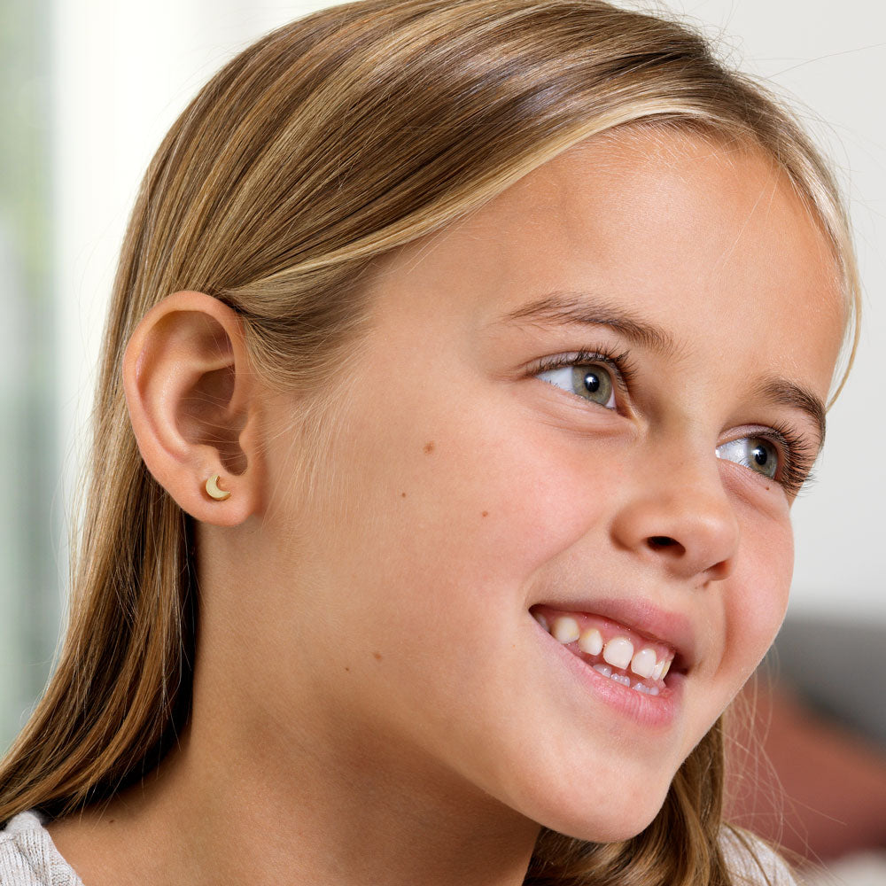 Young Girl wearing Golden Titanium Moon Earrings