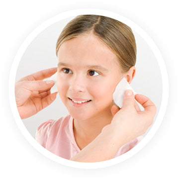 Disinfect ears with alcohol swabs to cleanse the piercing site of germs 