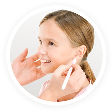 Marking spot on ear lobe in preparation for ear piercing