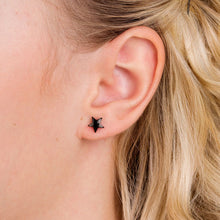 Load image into Gallery viewer, Model with Black titanium Star Ear Stud | Blomdahl Singapore
