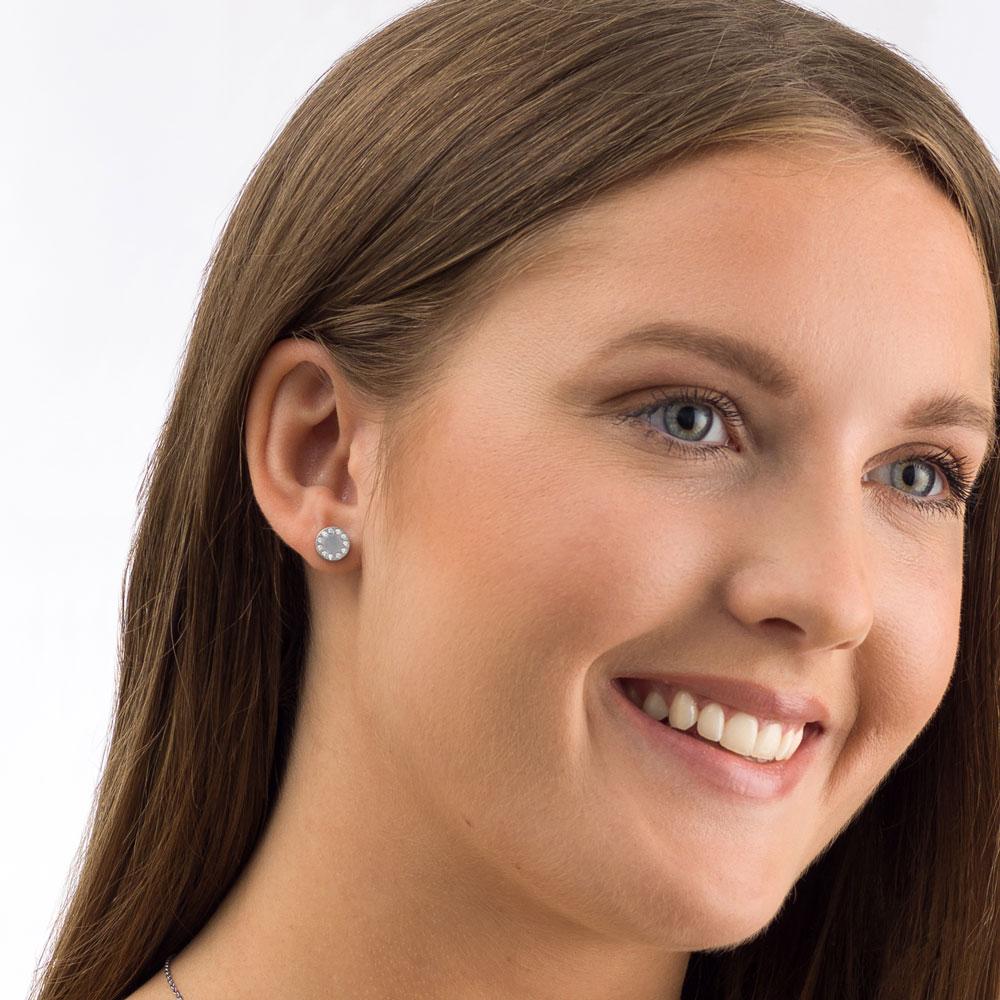 silver brilliance puck earring - silver titanium post jewelry - earrings for women, kids and girls - model up close
